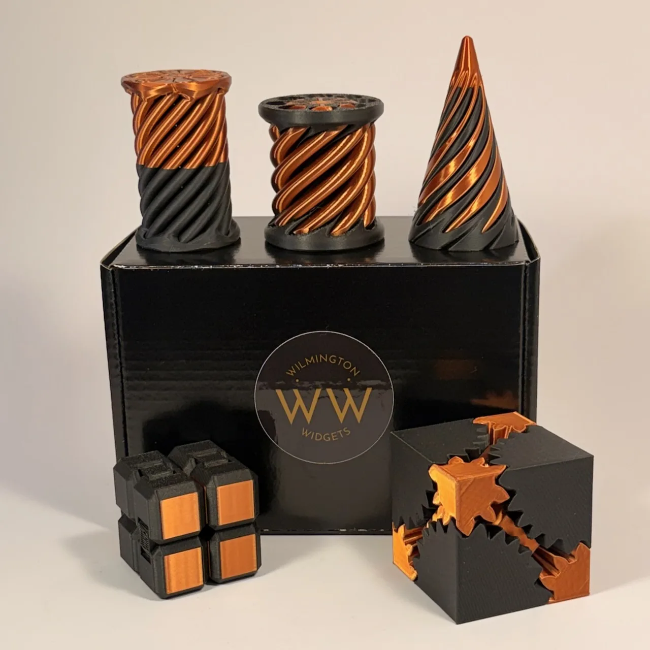 All five widgets staged on the black Wilmington Widgets box